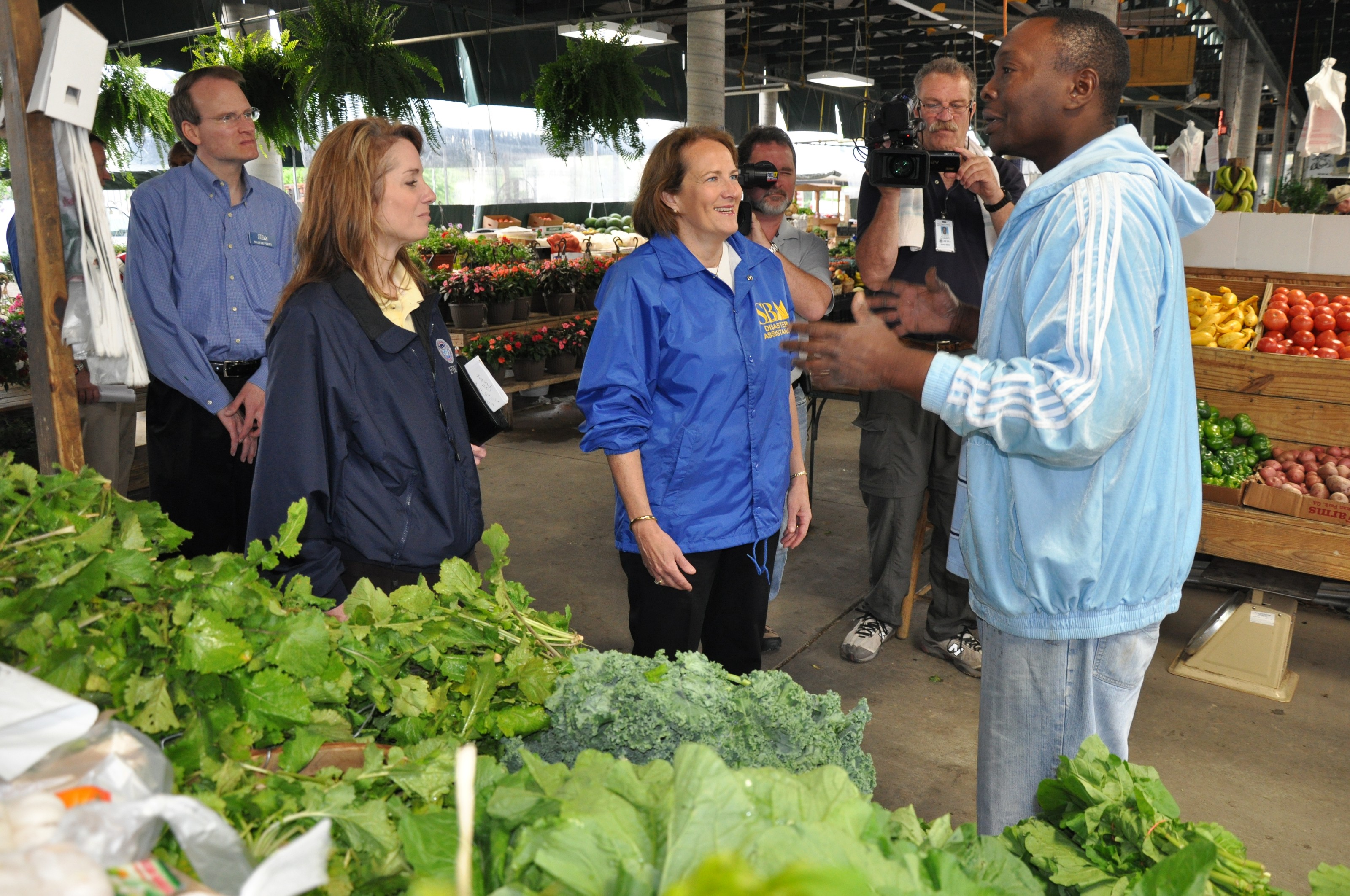 Vendors and shoppers inside Nashville Farmers' Market.