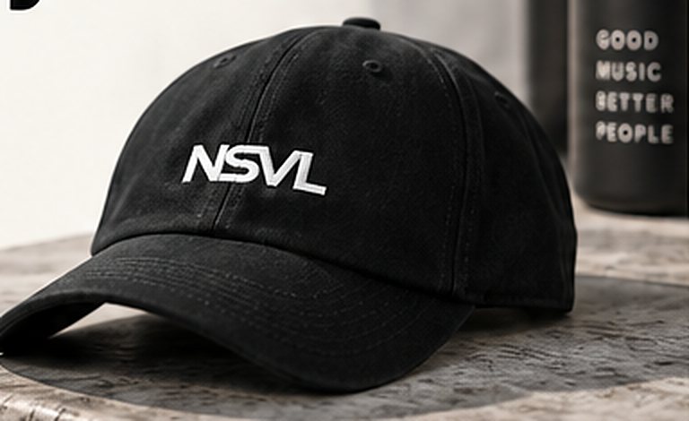 Illustration: a charcoal NSVL cap resting on a stone ledge beside a plant.