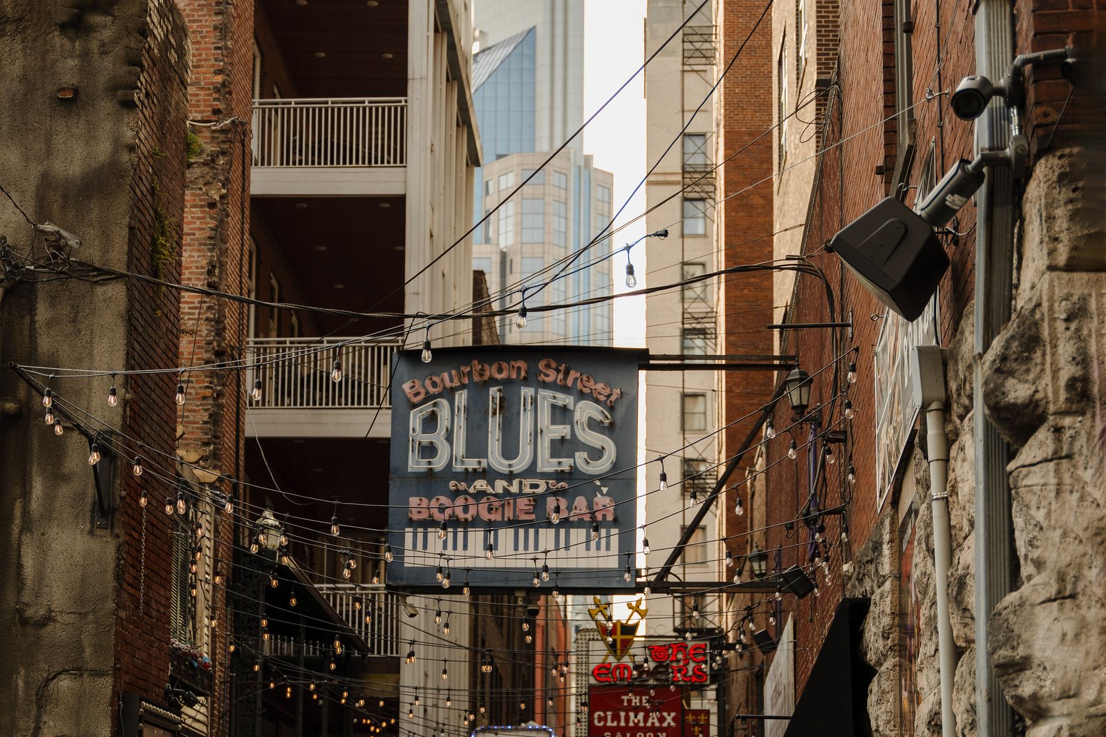 Urban alleyway with iconic blues bar signs in Nashville.