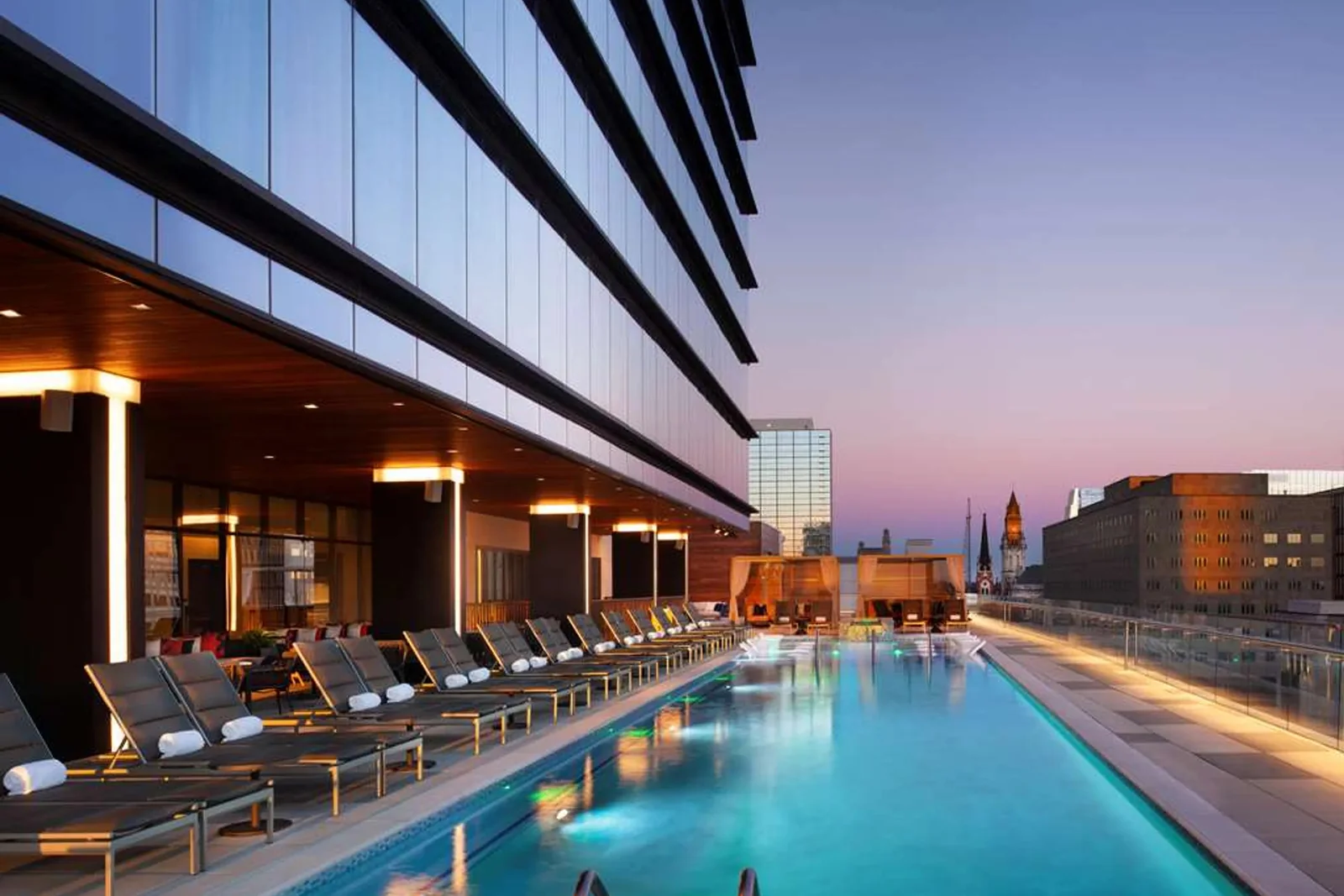 Grand Hyatt Nashville rooftop pool at twilight with Nashville Yards skyline context.