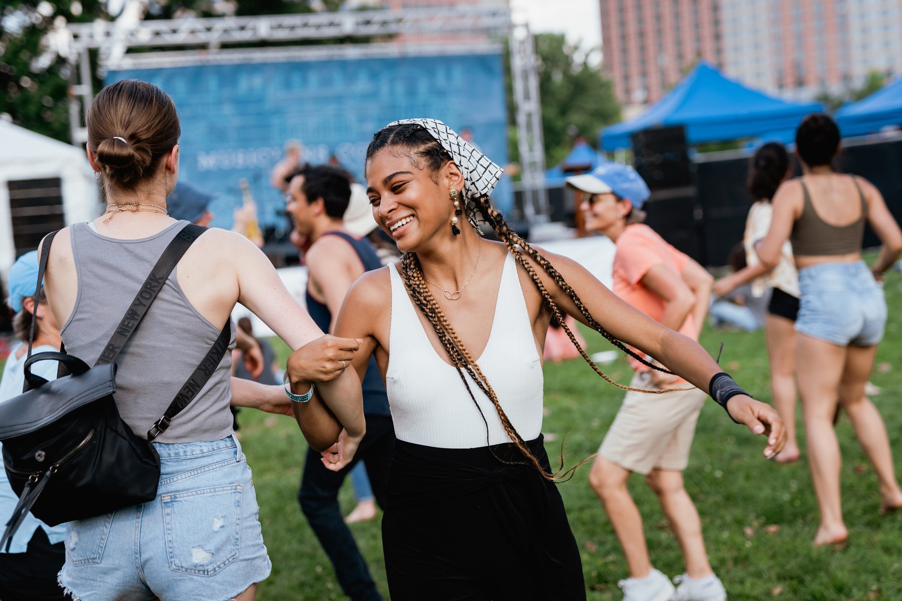 People dancing outdoors at a Musicians Corner concert in Nashville.