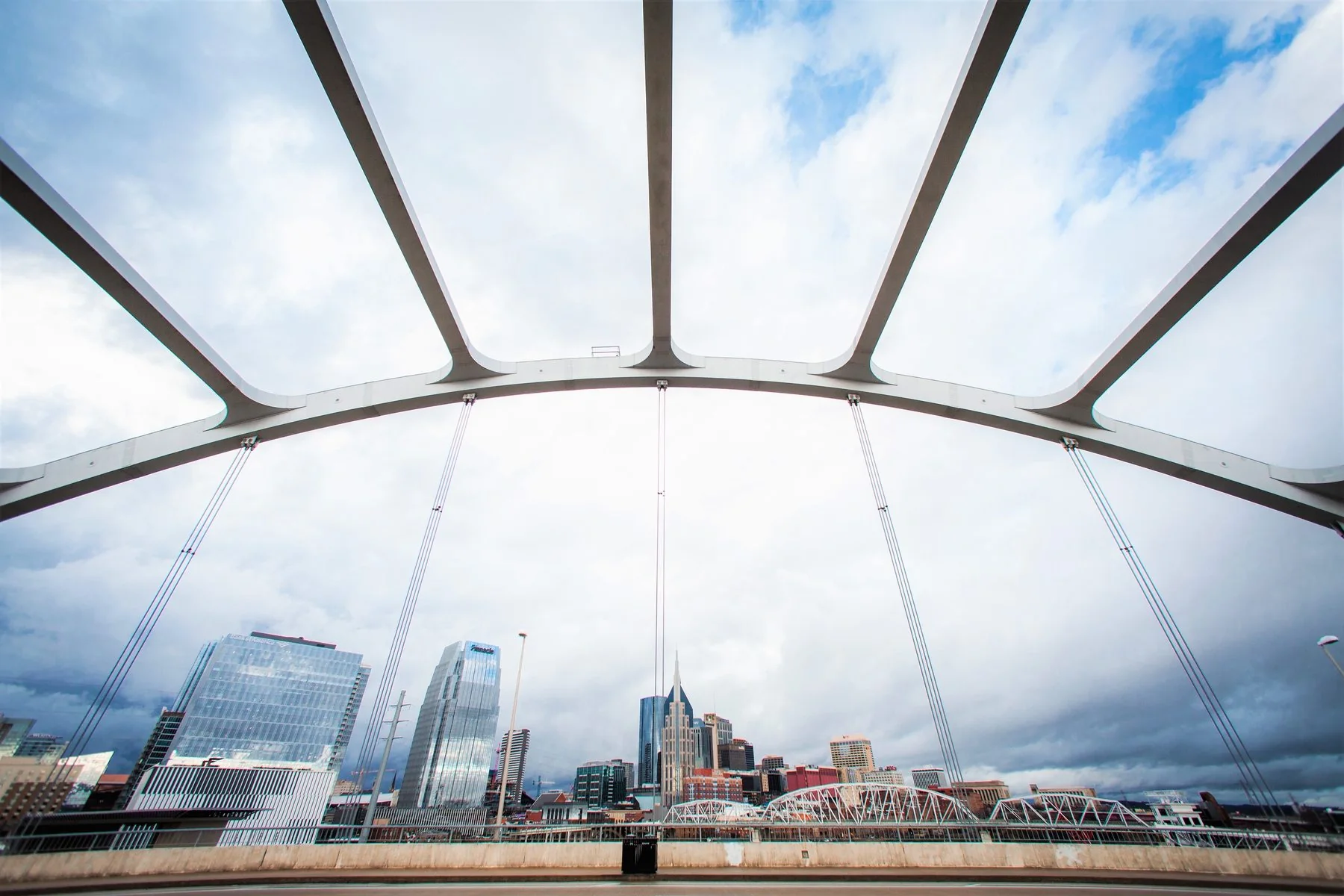 Nashville skyline seen from a pedestrian bridge.