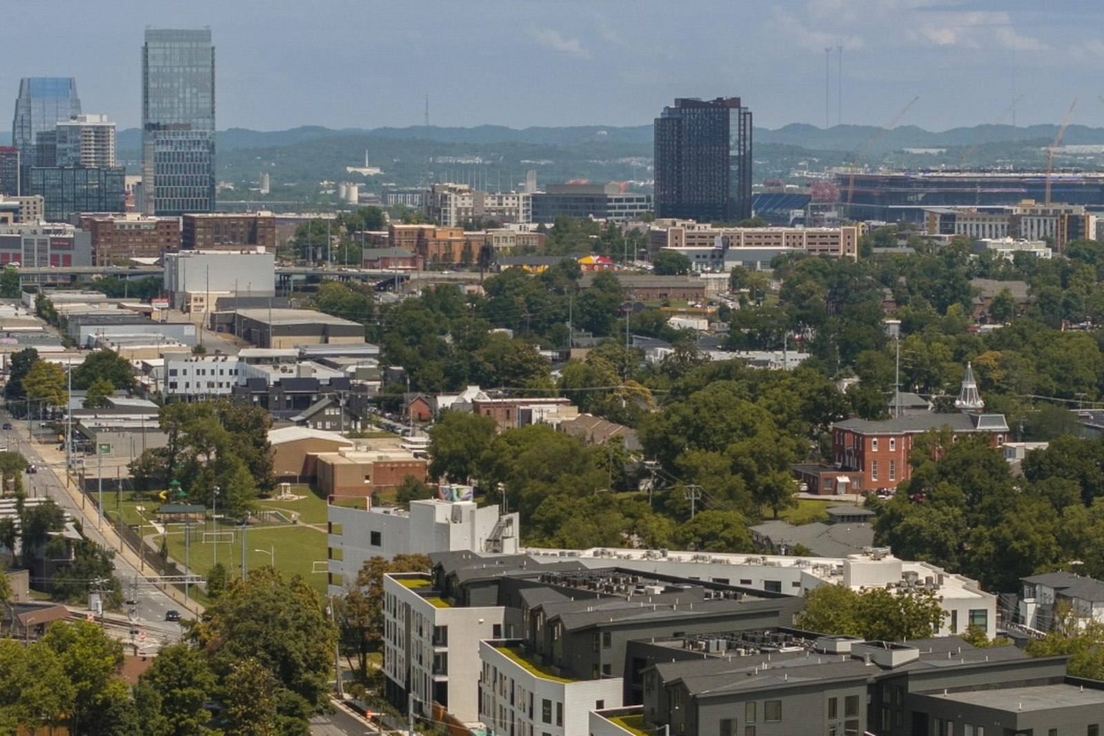 Aerial view from Wedgewood-Houston toward downtown Nashville, with neighborhood streets in the foreground.