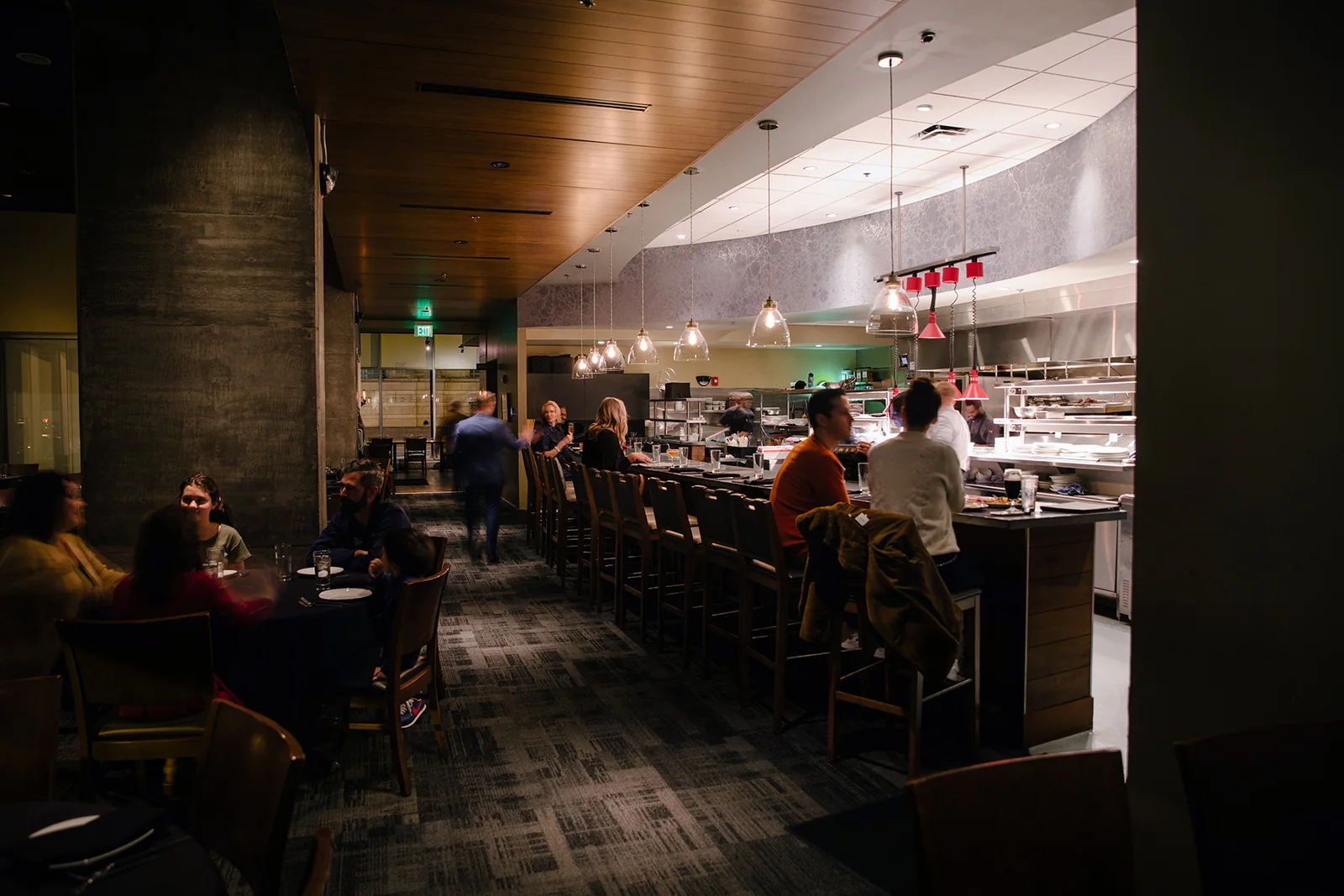 Populated dining room and chef's bar interior at etch restaurant downtown.